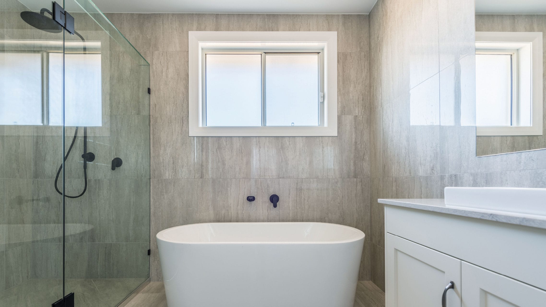 White Aluminium Sliding Window in a bathroom